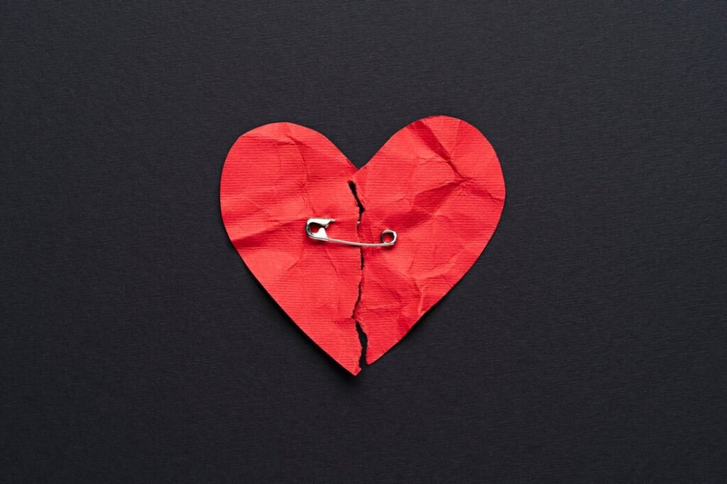 top view broken heart with safety pin 23 2149482346